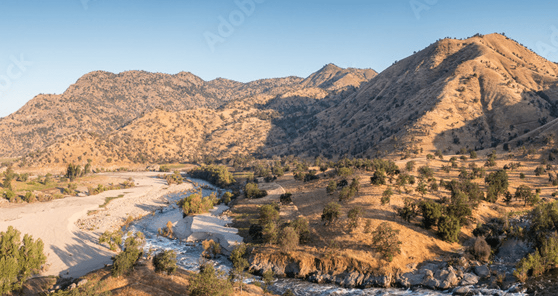 An image of a water stream in a desert landscape